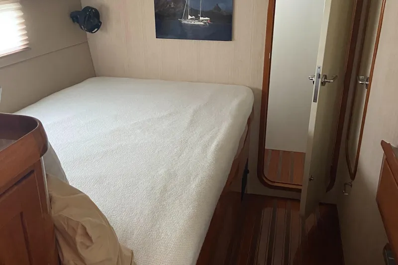 Slide: The Image of Cozy cabin interior of 1995 Kelly Dashew KELLY ARCHER yacht with bed and wooden accents. - 46