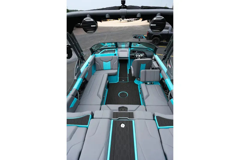 Slide: The Image of 2026 MasterCraft XT23 boat interior with gray and turquoise seating, sleek design. - 10