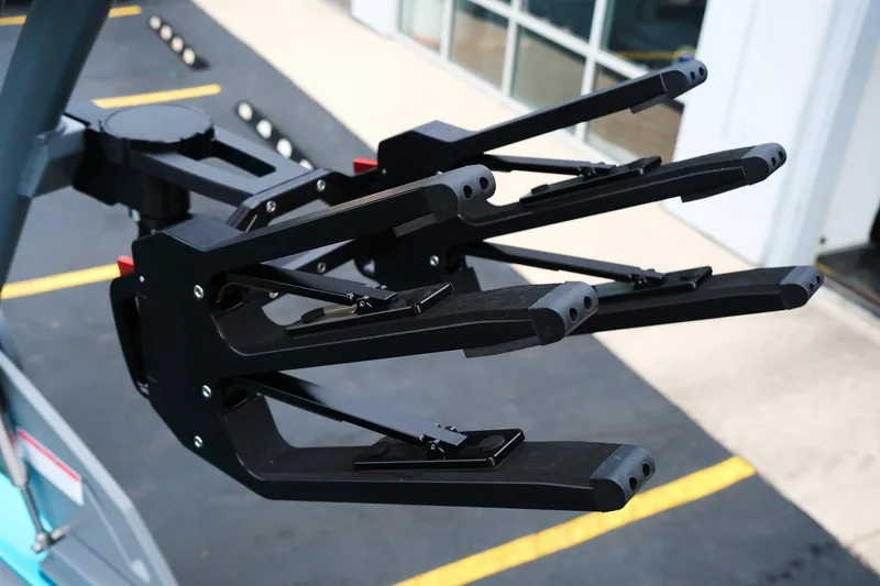 Slide: The Image of Close-up of 2026 MasterCraft XT23 boat rack with modern design and black finish. - 11