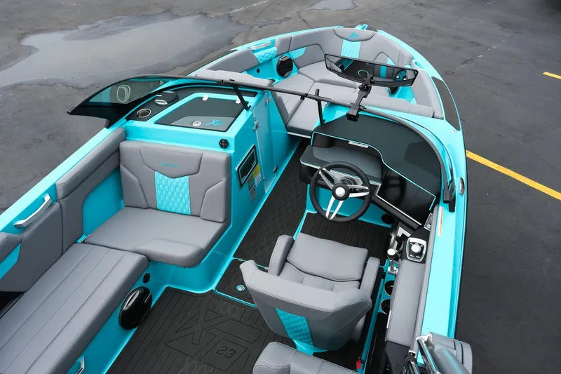 Slide: The Image of 2026 MasterCraft XT23 boat interior with modern design and turquoise accents. - 12