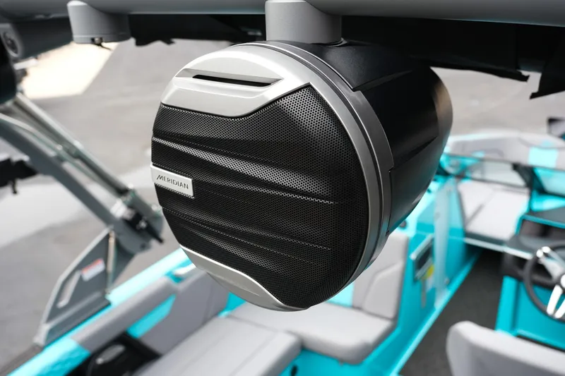 Slide: The Image of 2026 MasterCraft XT23 boat with Meridian speaker, featuring sleek interior design. - 13