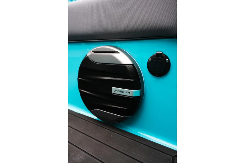Slide: The Image of 2026 MasterCraft XT23 boat with Meridian speaker on turquoise panel. - 25