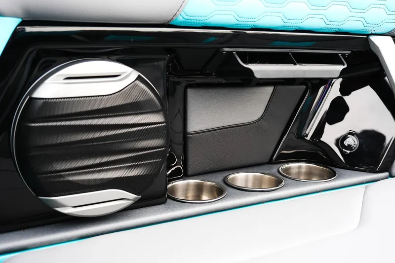 Slide: The Image of Interior of 2026 MasterCraft XT23 boat with speaker and cup holders. - 27