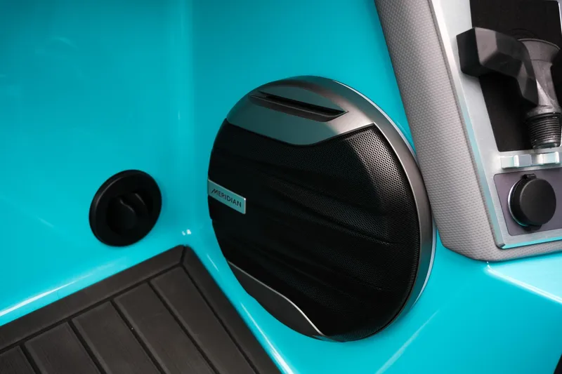 Slide: The Image of 2026 MasterCraft XT23 boat interior with Meridian speaker and turquoise accents. - 28