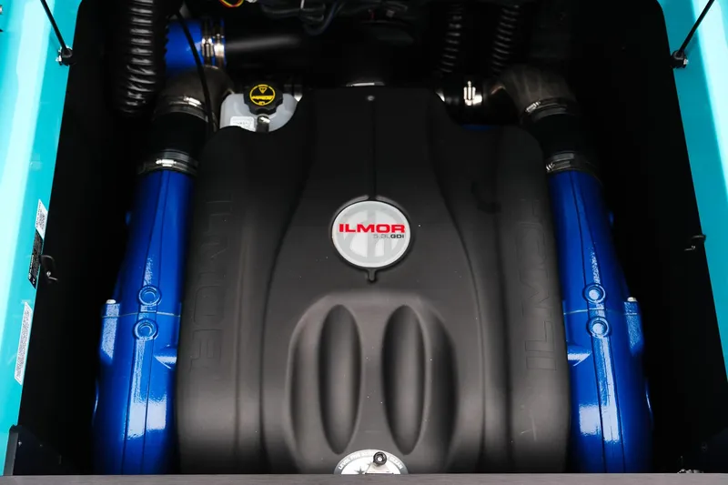 Slide: The Image of Engine of 2026 MasterCraft XT23 boat with Ilmor branding, featuring blue components. - 32