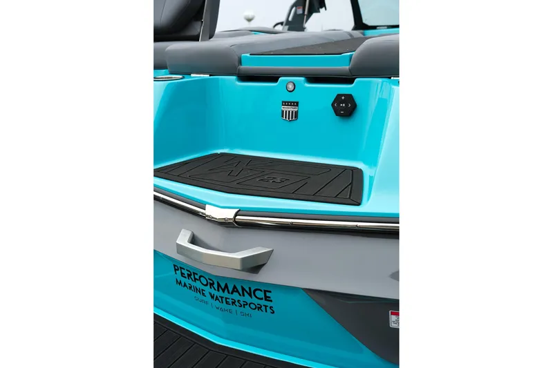 Slide: The Image of 2026 MasterCraft XT23 boat, turquoise rear deck with controls, Performance Marine Watersports branding. - 9
