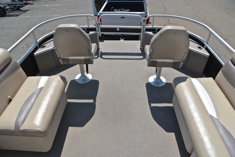 Slide: The Image of 2014 Godfrey SWEETWATER 2486 boat interior with beige seating and railing. - 20