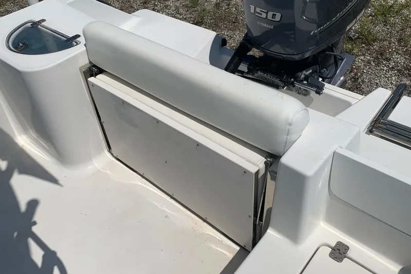 Slide: The Image of 2015 Sportsman Open 212 Center Console boat with Yamaha 150 engine, rear seating view. - 12