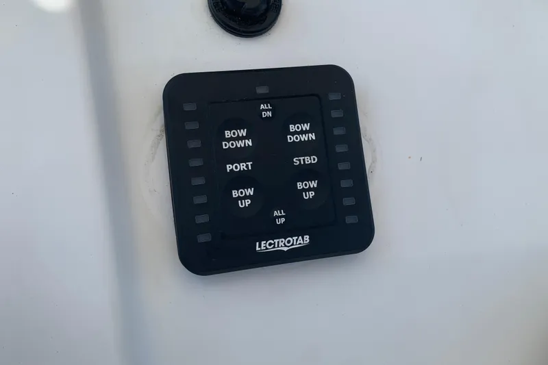 Slide: The Image of Control panel of a 2015 Sportsman Open 212 Center Console boat. - 16