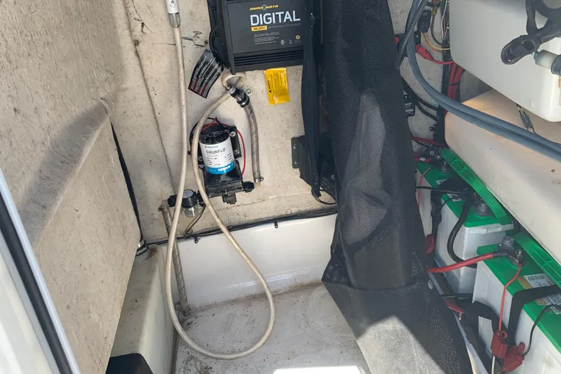 Slide: The Image of 2015 Sportsman Open 212 Center Console interior with wiring and equipment. - 19