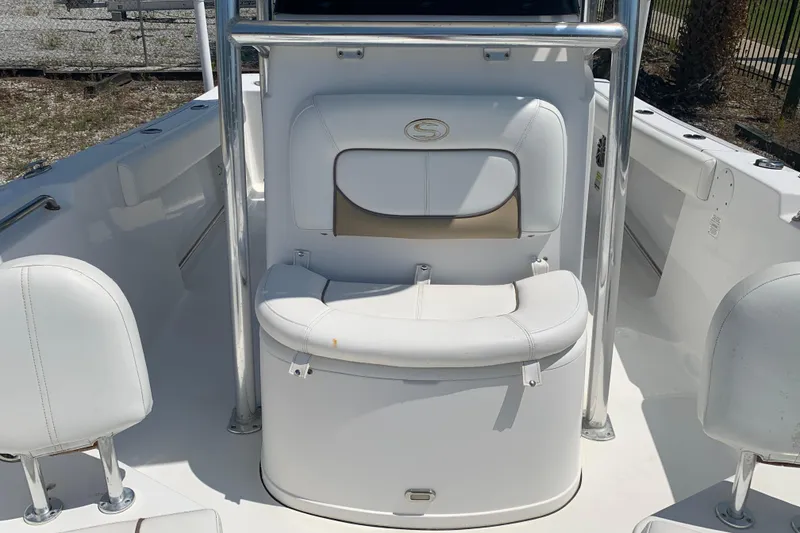 Slide: The Image of 2015 Sportsman Open 212 Center Console boat interior with white seating. - 22