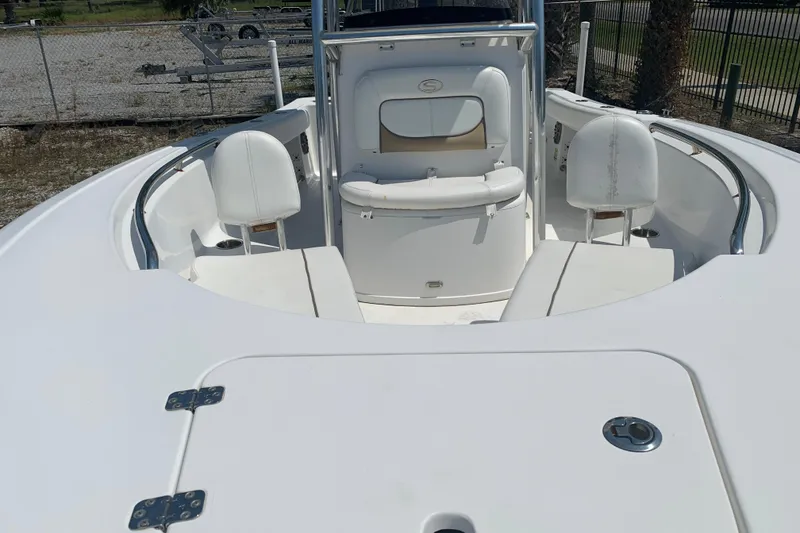 Slide: The Image of 2015 Sportsman Open 212 Center Console boat interior with seating and console view. - 23
