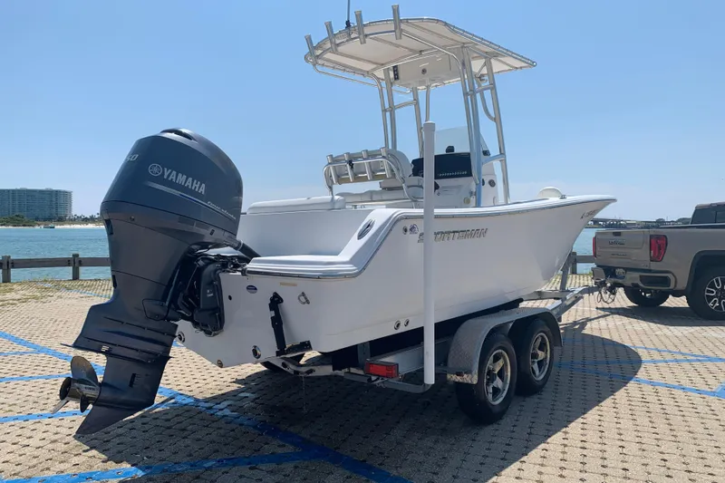 Slide: The Image of 2015 Sportsman Open 212 Center Console boat on trailer with Yamaha outboard motor. - 4