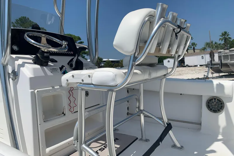 Slide: The Image of 2015 Sportsman Open 212 Center Console boat interior with steering wheel and seating. - 9