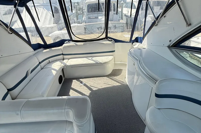 Slide: The Image of 1999 Formula 400 Super Sport boat interior with white seating and blue accents. - 11