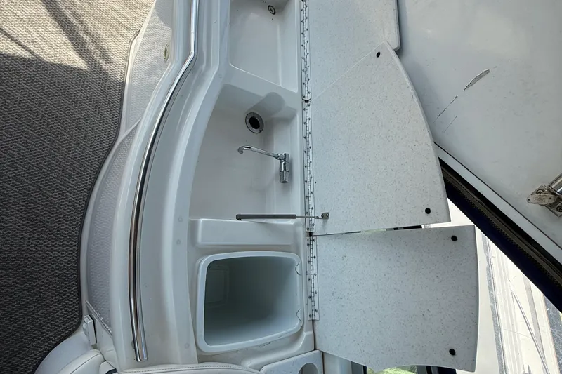 Slide: The Image of Interior view of a 1999 Formula 400 Super Sport boat sink area. - 14