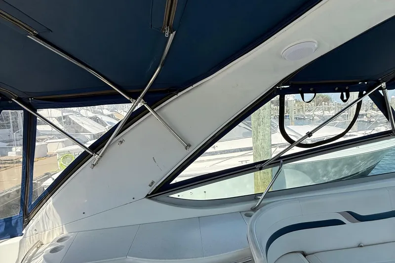 Slide: The Image of Interior view of a 1999 Formula 400 Super Sport boat with blue canopy. - 15
