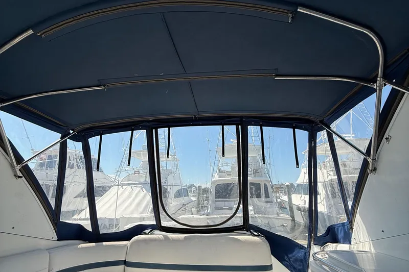 Slide: The Image of Interior view of a 1999 Formula 400 Super Sport boat with marina backdrop. - 17