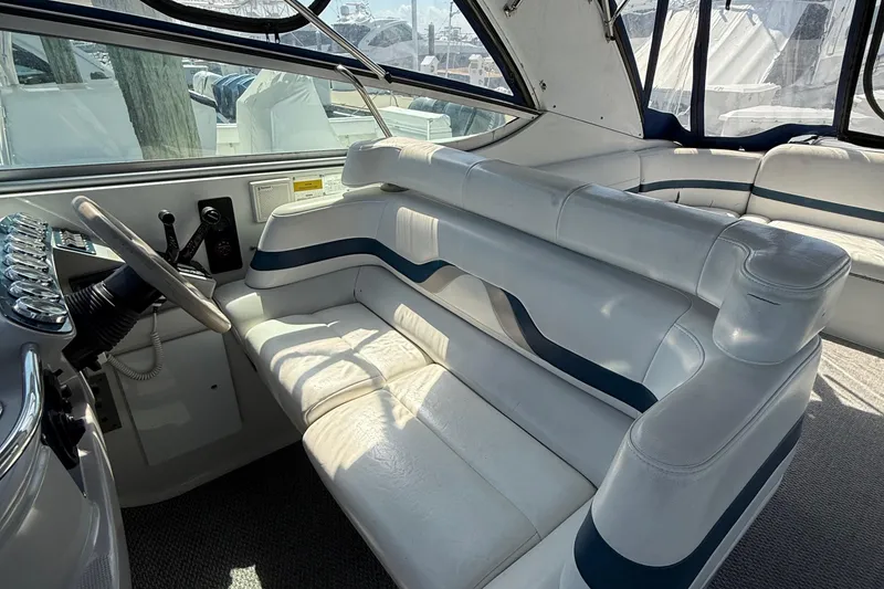 Slide: The Image of Interior of a 1999 Formula 400 Super Sport boat with white leather seating. - 19