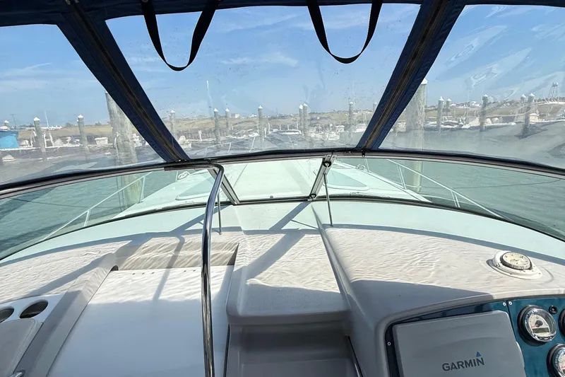 Slide: The Image of 1999 Formula 400 Super Sport boat interior with Garmin navigation, docked at marina. - 23