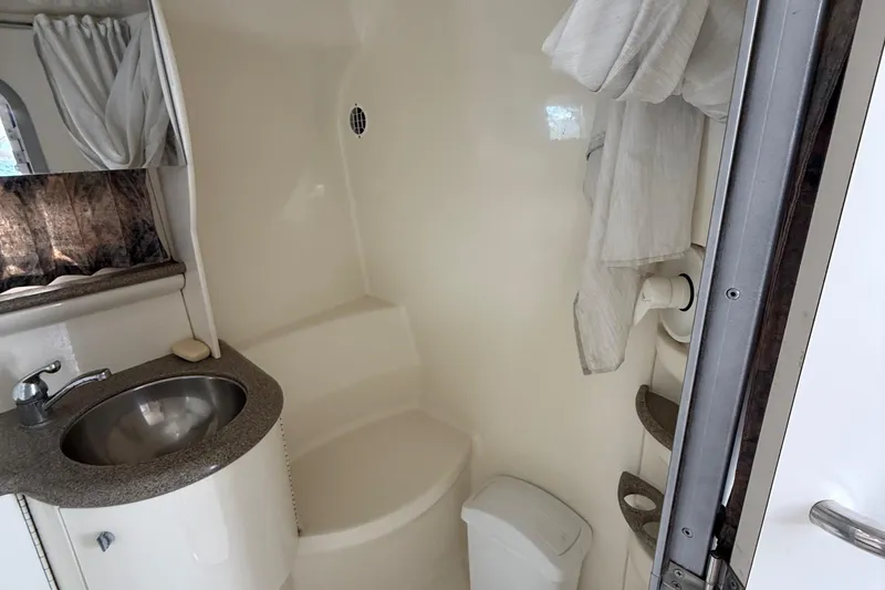 Slide: The Image of 1999 Formula 400 Super Sport bathroom with sink, shower, and storage. - 25