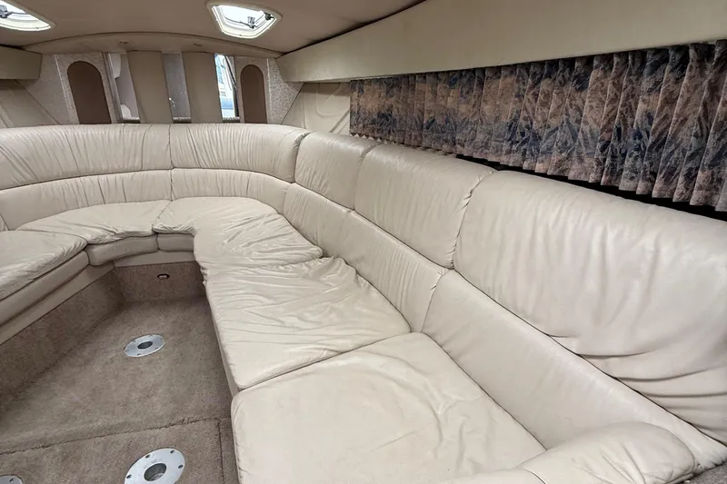 Slide: The Image of Interior of a 1999 Formula 400 Super Sport boat with beige leather seating. - 32
