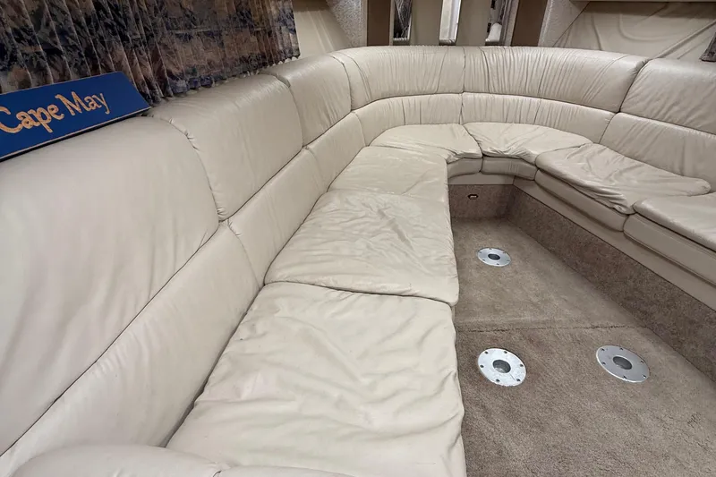 Slide: The Image of 1999 Formula 400 Super Sport interior with beige leather seating and carpeted flooring. - 33
