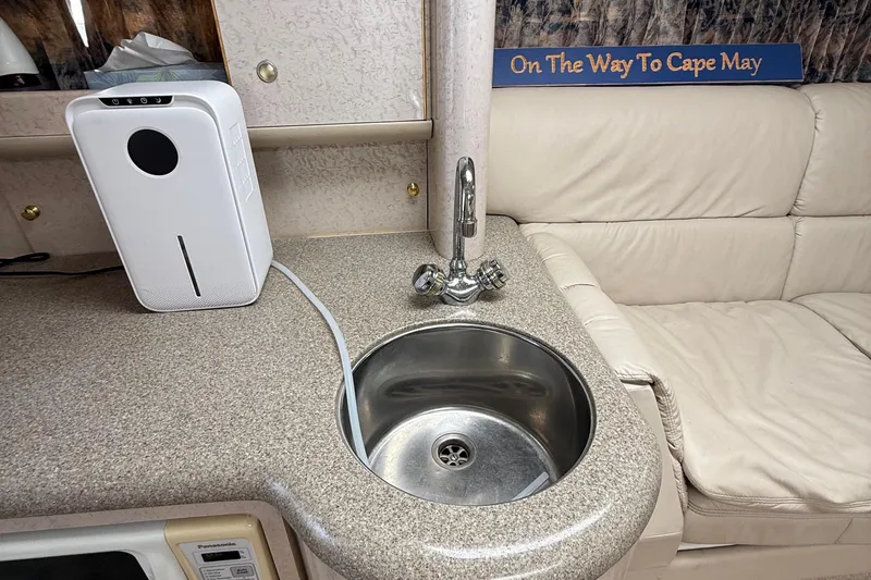 Slide: The Image of Interior of a 1999 Formula 400 Super Sport with sink and countertop appliance. - 34