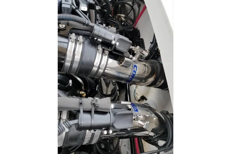 Slide: The Image of Engine components of a 1999 Formula 400 Super Sport boat, featuring polished metal parts. - 41