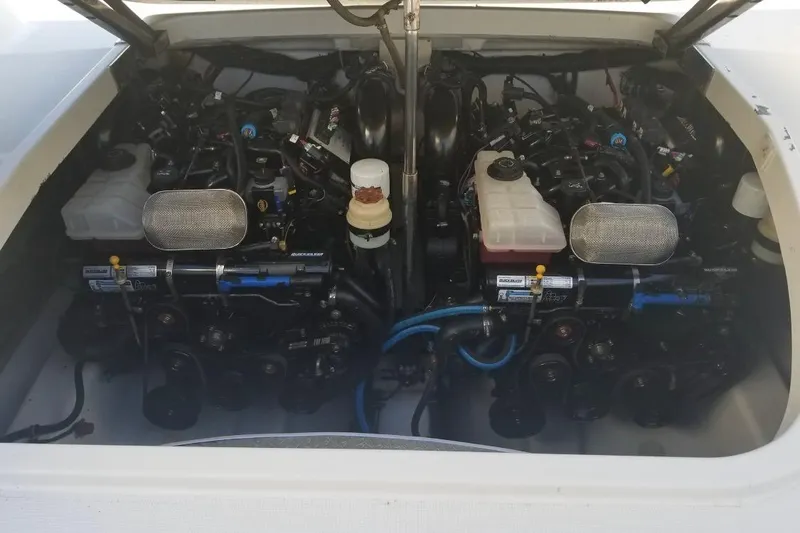 Slide: The Image of Engine compartment of a 1999 Formula 400 Super Sport boat, showcasing dual engines. - 45