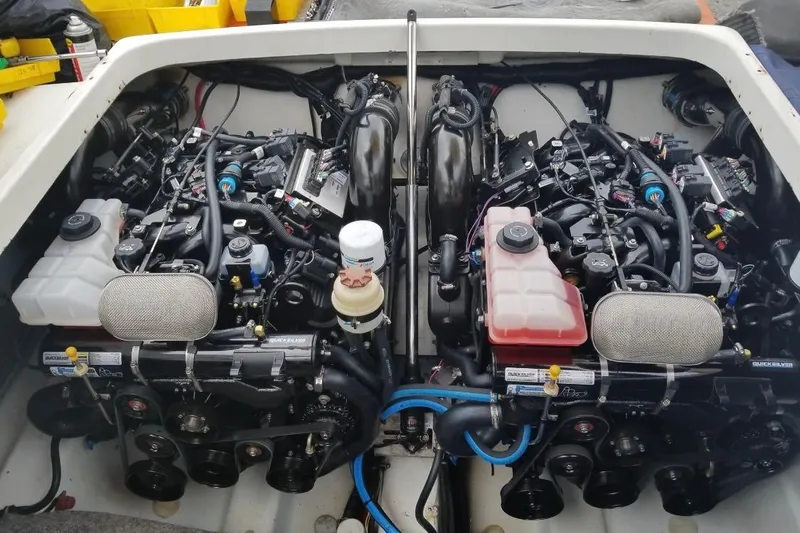 Slide: The Image of Engine compartment of a 1999 Formula 400 Super Sport boat, showcasing dual engines. - 47
