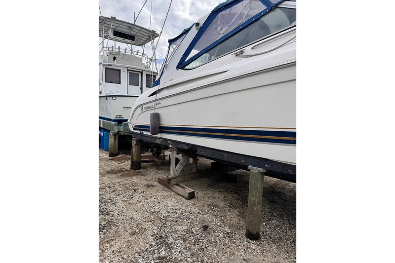 Slide: The Image of 1999 Formula 400 Super Sport boat on dry dock, side view. - 55