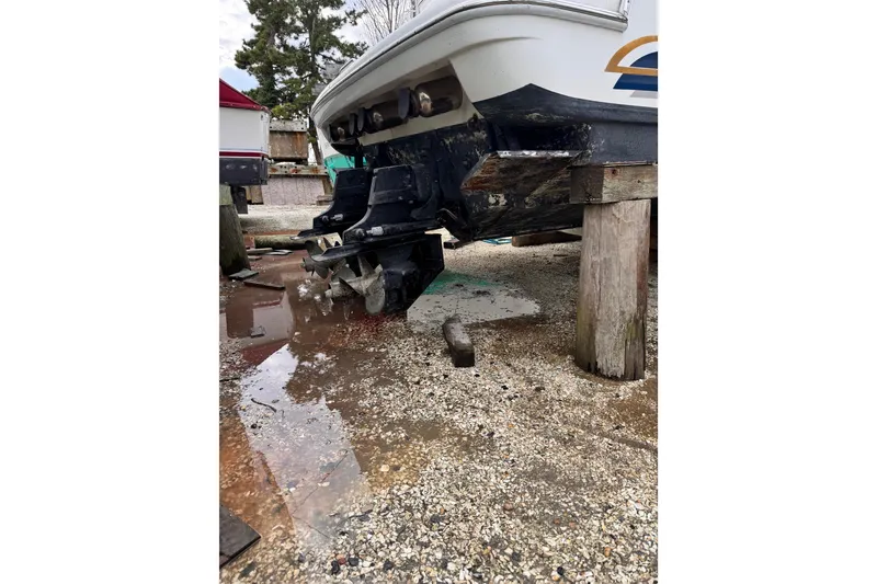 Slide: The Image of 1999 Formula 400 Super Sport boat on stands, showing stern and outdrive. - 56