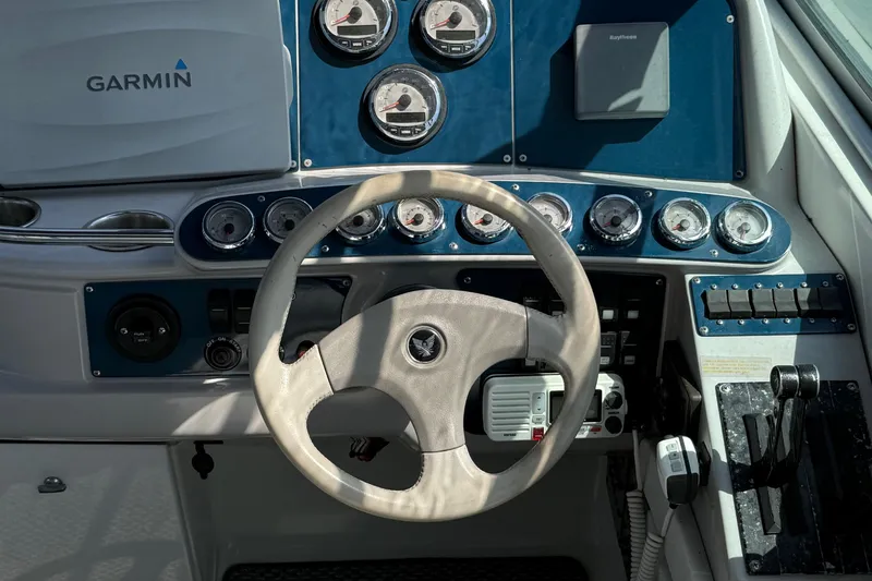 Slide: The Image of Dashboard of a 1999 Formula 400 Super Sport boat with Garmin navigation. - 6