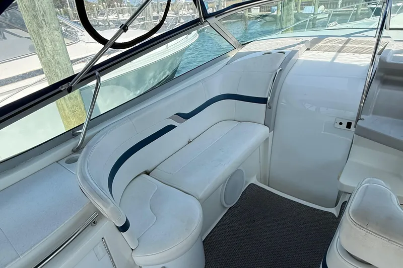Slide: The Image of 1999 Formula 400 Super Sport boat interior with white seating and blue accents. - 7