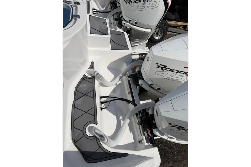 Slide: The Image of 2022 Invincible 40 Catamaran with dual Racing 450 engines, showcasing sleek design and power. - 10