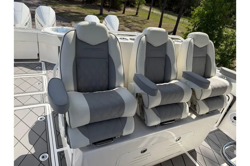 Slide: The Image of Luxurious seating on 2022 Invincible 40 Catamaran, featuring three plush, ergonomic chairs. - 11