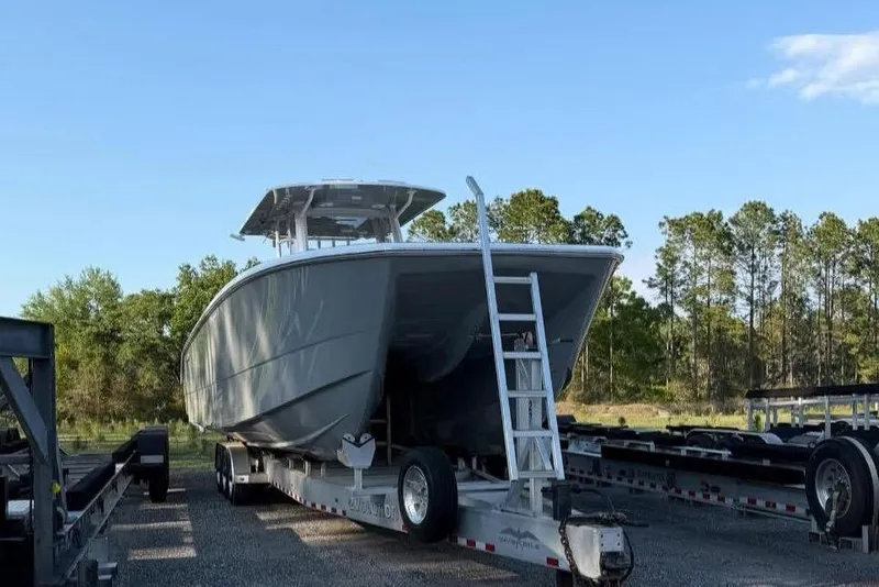 The Image of Invincible 40 Catamaran 2022 parked on trailer outdoors. - 2