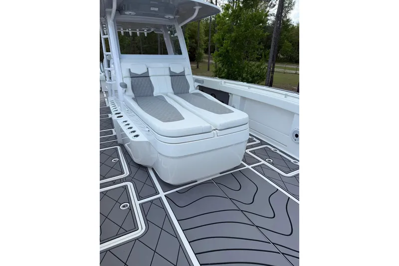 Slide: The Image of 2022 Invincible 40 Catamaran with sleek seating and modern deck design. - 4