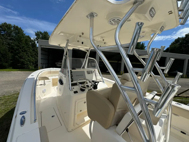 Slide: The Image of 2013 Cobia 296 Center Console boat with sleek design and modern features. - 18