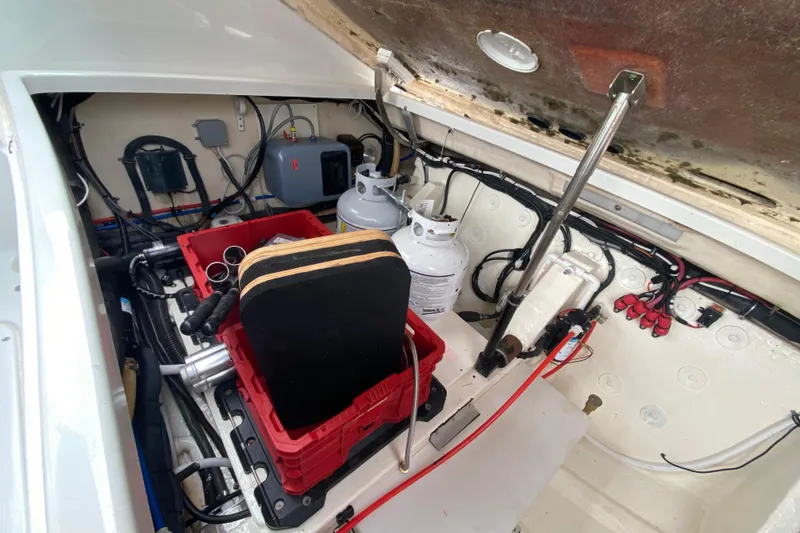 Slide: The Image of Engine compartment of 2009 Formula 330 Sun Sport boat with equipment and storage. - 36