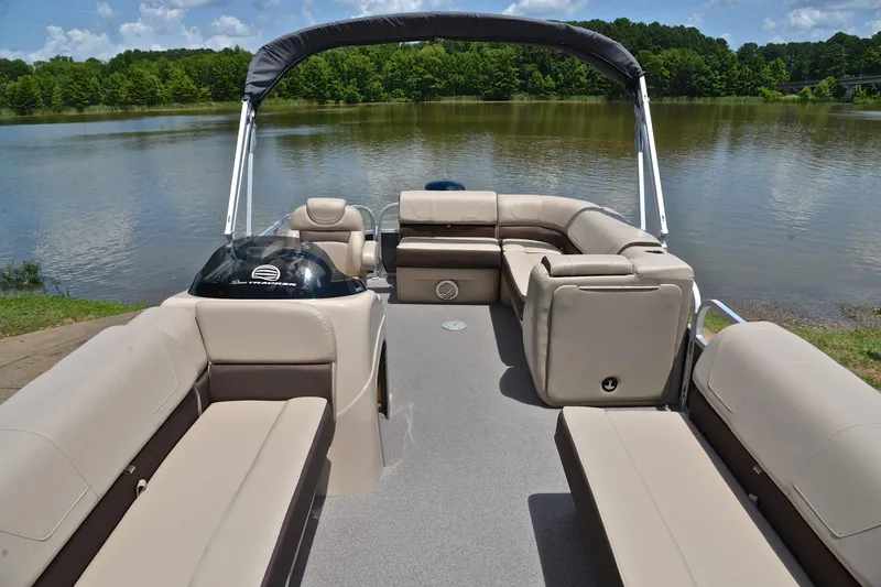 Slide: The Image of 2018 Sun Tracker Party Barge 20 pontoon boat on a serene lake. - 19