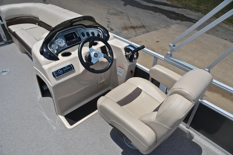 Slide: The Image of 2018 Sun Tracker Party Barge 20 interior with steering console and seating. - 24