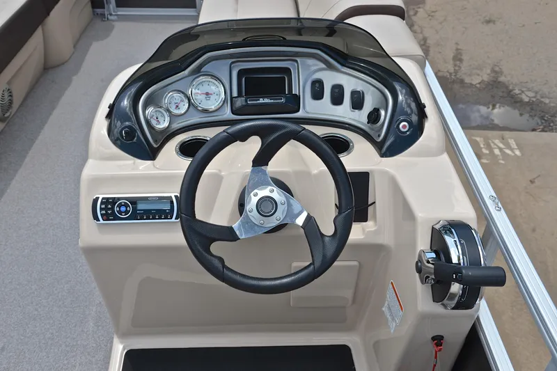 Slide: The Image of 2018 Sun Tracker Party Barge 20 dashboard with steering wheel and controls. - 25
