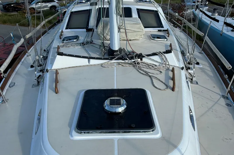 Slide: The Image of Deck view of 2011 Tartan 4700 sailboat with rigging and hatches. - 11