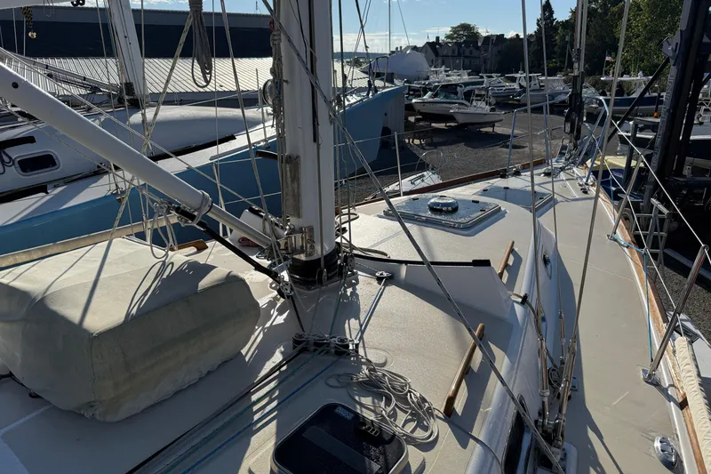 Slide: The Image of Sailboat deck view of 2011 Tartan 4700, docked with rigging and equipment visible. - 17