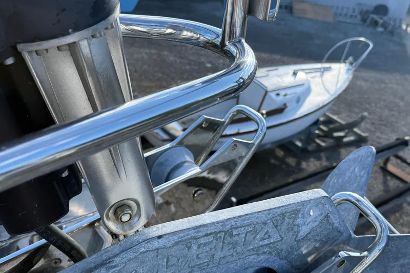 Slide: The Image of Close-up of Tartan 4700 sailboat anchor and railing, 2011 model. - 23
