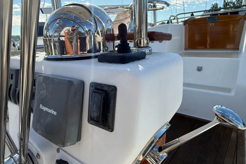 Slide: The Image of Cockpit of 2011 Tartan 4700 sailboat with Raymarine equipment and polished metal details. - 28