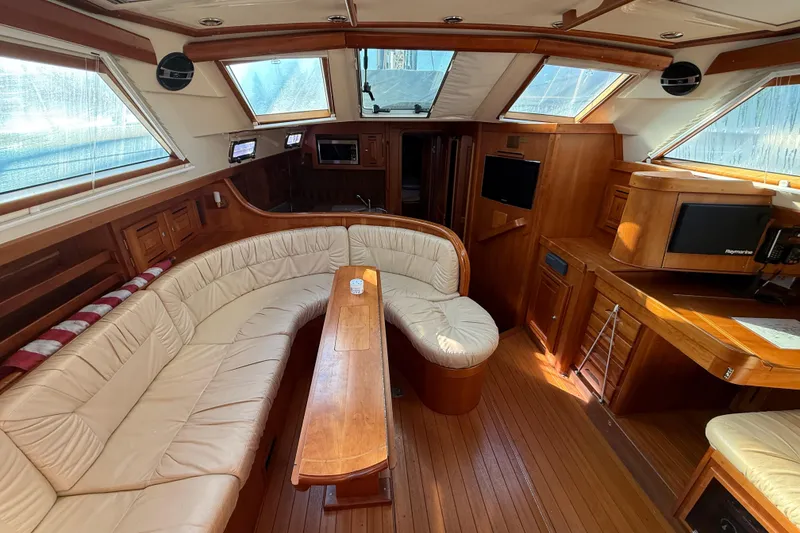 Slide: The Image of Luxurious interior of 2011 Tartan 4700 yacht with leather seating and wooden finishes. - 37