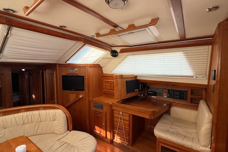 Slide: The Image of Luxurious interior of 2011 Tartan 4700 yacht with wood finish and comfortable seating. - 40